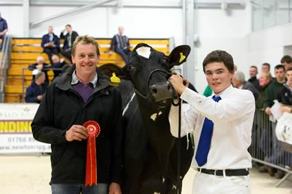 Lancashire Holstein club chairman David Booth presenting class 9 winner R and E Butterfield